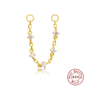Detail showing gold 925 sterling silver chain earring with five white zircon stones