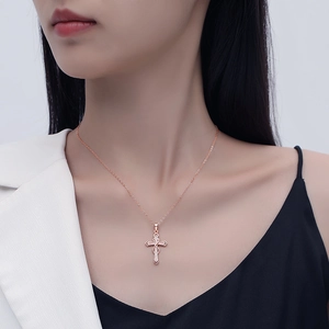 Elegant s925 silver necklace featuring a rose gold infinity cross heart pendant on a model