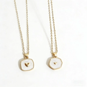 Gold star moon and heart pendant necklaces with white enamel on a polished chain