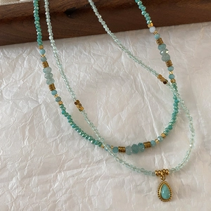 Natural blue amazonite beaded necklace with gold accents and a water drop pendant