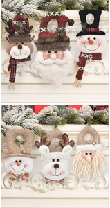 Detail of Christmas gift bags featuring Santa, snowman and reindeer on fireplace mantel