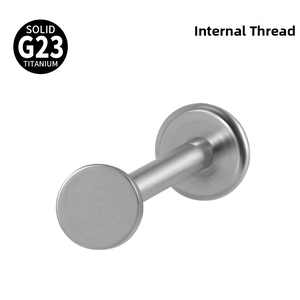 Macro detail of G23 solid titanium piercing stud with internal thread and flat base