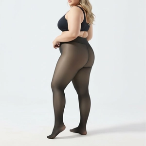 Detail view of high waist plus size black translucent tights with body shaping effect