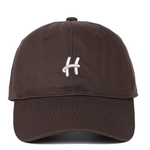 Close-up of white letter H embroidery on a dark brown cotton twill baseball cap
