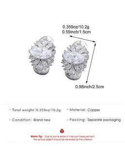 Detailed view of silver flower cluster earrings featuring marquise and round cubic zirconia