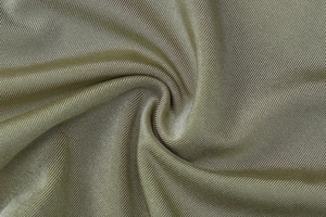 Detailed macro view of olive green ribbed knit fabric showing the fine yarn texture