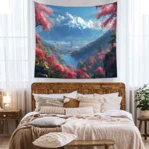 Detailed close-up of a bohemian Mount Fuji tapestry hanging over a cozy bedroom headboard
