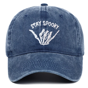 Detail of Stay Spooky embroidery on dark blue washed vintage denim baseball cap