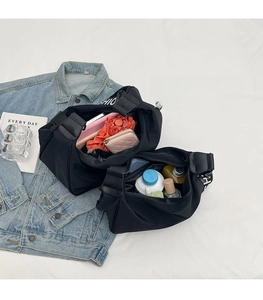 Spacious black oxford cloth bag showing interior storage for umbrella and wallet