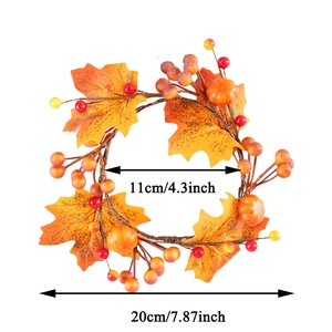 Detail view of pumpkin candle ring showing maple leaves and dimensions 20cm outer diameter