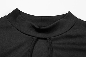 Detailed view of black mock neck dress featuring a teardrop cutout and knitted texture