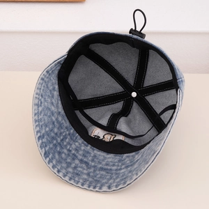 Inside view of adjustable denim bucket hat with internal sweatband and drawstring