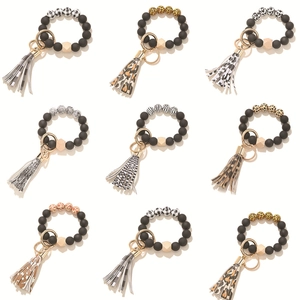 Silicone bead keychain bracelets with matte black wood beads and tassel pendants