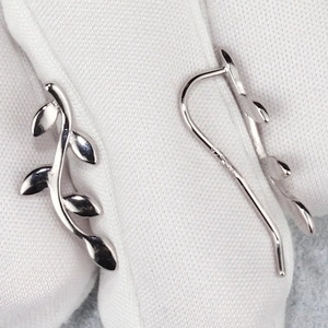 Close-up of S925 sterling silver leaf ear cuff showing the hallmark and polished finish