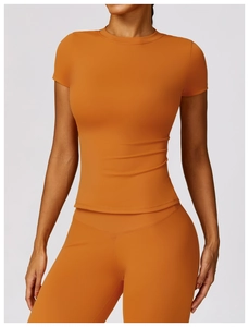 Detail of caramel high-stretch yoga set with round neck short sleeve top and leggings