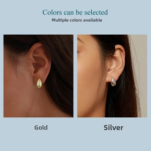 Polished teardrop stud earrings shown in gold and silver finishes on a model