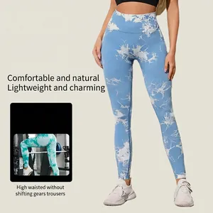 High-waisted tie-dye yoga pants in sky blue with peach butt lift and seamless fit