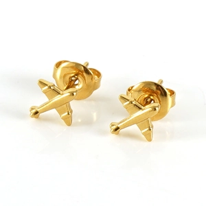 Macro view of gold-plated airplane stud earrings with a polished finish and butterfly back