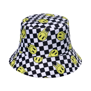 Black and white checkered bucket hat with yellow melting smiley face prints