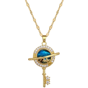 Elegant gold key necklace with a blue starry planet pendant and sparkling crystals