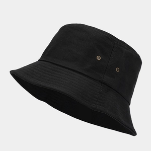 Detail view of cotton bucket hat side with two metal eyelets for ventilation
