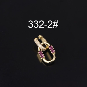 Detail of gold-plated linked earrings featuring clear crystals and purple zircon stones