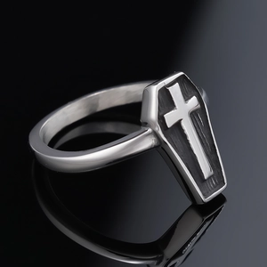 Gothic coffin ring with 3D cross, vintage polished stainless steel detail on black background