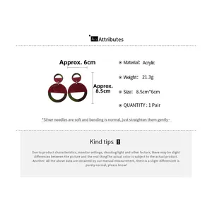 Macro view of acrylic contrast earrings with dimensions 8.5cm by 6cm on white background