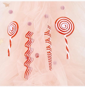 Detail of red and white acrylic candy canes and lollipops for Christmas tree decoration