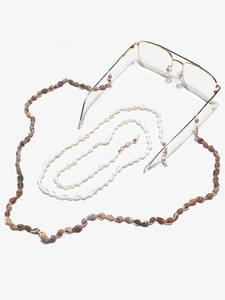 Detail of natural conch shell eyewear chains with non-slip white silicone loops