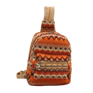 Ethnic style woven sling bag with orange and beige geometric patterns on white background