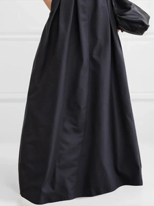 Elegant black high-waisted A-line maxi skirt with pleated design and voluminous flare