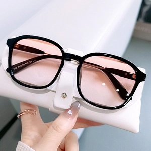 Vintage oversized black frame sunglasses with pink gradient lenses and metal accents