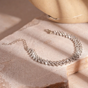 Detail of silver triple-row zircon bracelet with adjustable lobster clasp and extender
