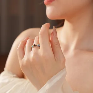 Gold open ring with blue and black enamel evil eye design and zircon stones for women