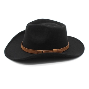 Detail of black felt fedora hat featuring a brown leather decorative band and metal buckle
