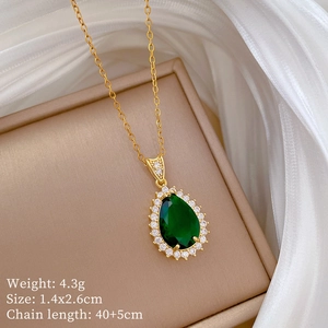 Detail shot of pear-cut emerald pendant with micro-pave diamonds and product dimensions