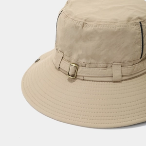 Detail of khaki outdoor sun hat featuring reinforced stitching and metal buckle
