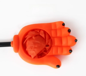 Detailed view of an orange cat paw shaped mesh candy bag for Halloween trick or treating