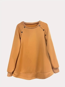 Women's crewneck long sleeve mustard yellow sweatshirt with button details and high-low hem