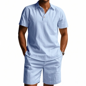 Detail of light blue cotton linen polo shirt and shorts set with natural texture