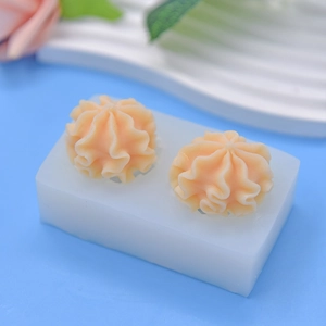 Flower shaped silicone mold for DIY baking and handmade soap on blue background
