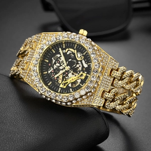 Macro shot of gold-plated iced-out watch with hollow dial and luxury crystal embellishments