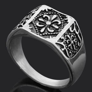Close-up of vintage wolf head Thor's hammer ring with engraved runes in antique silver