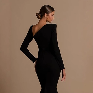 Elegant black long sleeve backless maxi dress with cut-out detail and mermaid silhouette