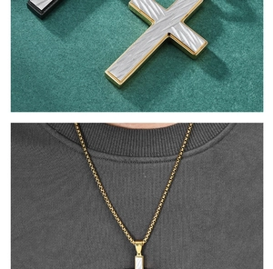 Close-up of gold and black cross pendants with textured inlay and matching box chain