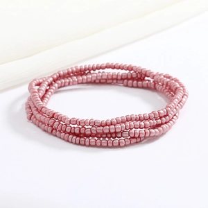 Detail of pink pearlescent beaded body chain with multi-layer seed beads on silk