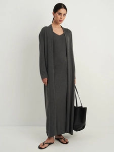 Detail view of the soft knitted texture on the dark grey cardigan and maxi dress set