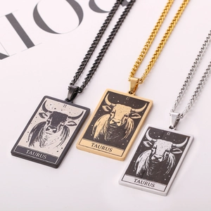 Three Taurus zodiac rectangle pendant necklaces in black, gold, and silver finishes