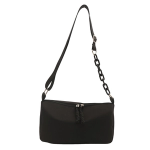 Minimalist black nylon pillow bag with plastic chain strap and silver hardware accents